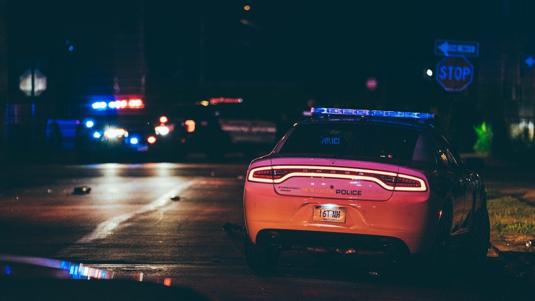 detective investigating crime scene at night