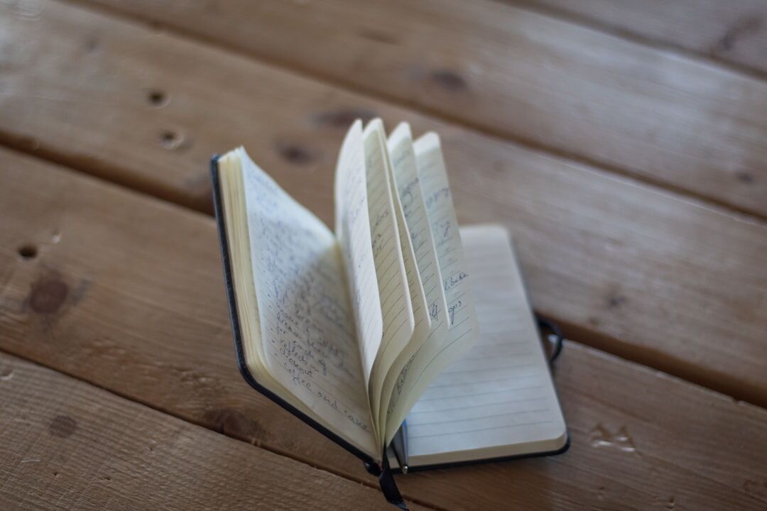 open book with handwritten notes